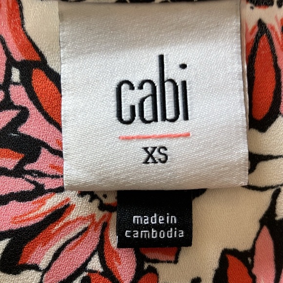 Cabi Seraphina #5730 Daisy ruffled flowy top over spaghetti strapped B&W tank. - Picture 9 of 10